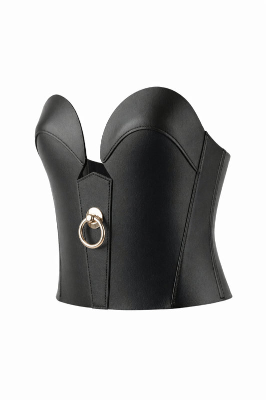 Black leather corset with a gold ring on a white background