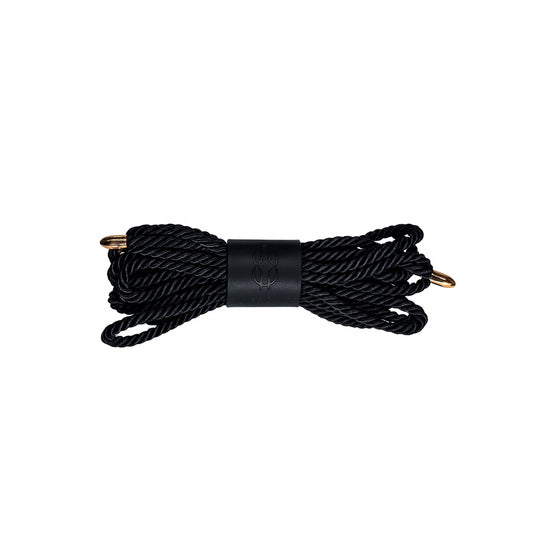 Hand-knotted Decorative Cord – Shibari Art in black with gold tips, coiled with embossed leather band